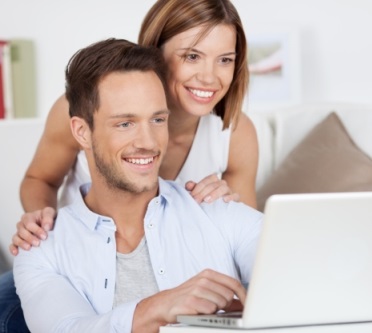 Couple using online service to find rental housing